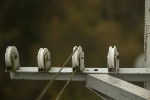 Clotheslines for drying clothes. Ropes outside window are stretched over coil Stock Photos