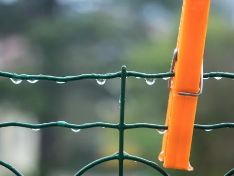 Clothespin and rain drop springtime Stock Photos