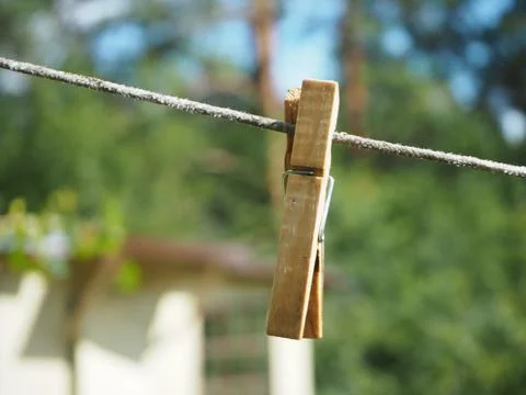 Clothespin for drying clothes on a cord Stock Photos