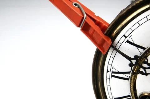 Clothespin stop the clock. Stock Photos