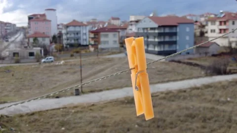 A clothespin swinging on a clothesline, 스톡 동영상 293081544