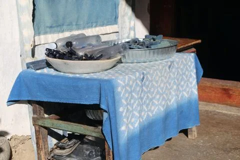 Clothespins and bottles on a blue patterned tablecloth in bright sunlight Stock Photos