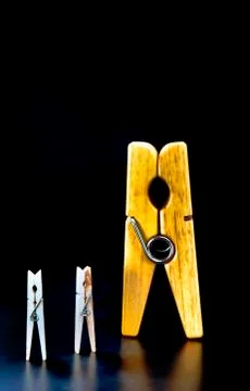 Clothespins on Black Background. Stock Photos