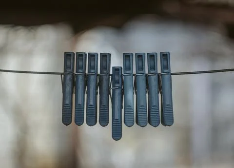 Clothespins on a blurred background Stock Photos