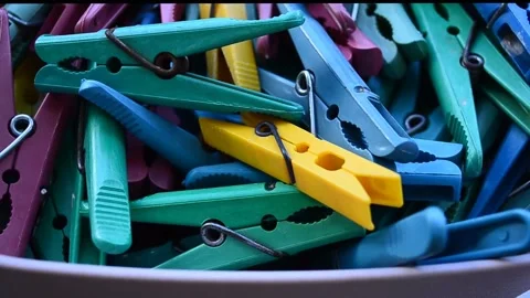Clothespins of different colors in the box have camera movement 스톡 동영상 309847035