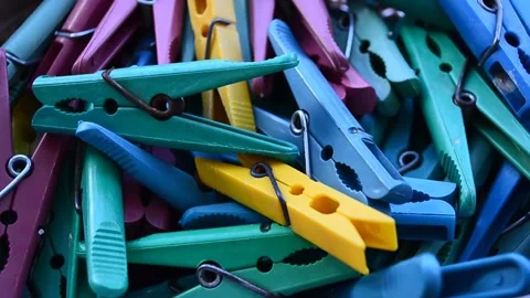 Clothespins of different colors in the box have camera movement 스톡 동영상 309847044