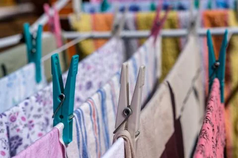 Clothespins hold the laundry. Stock Photos