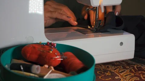 Clothier. Sewing on a typewriter, mending. Stock Footage 128254430