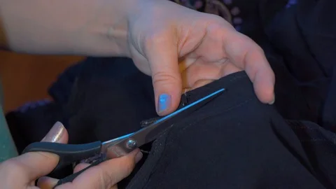 Clothier. Sewing on a typewriter, mending. Stock Footage 128254445