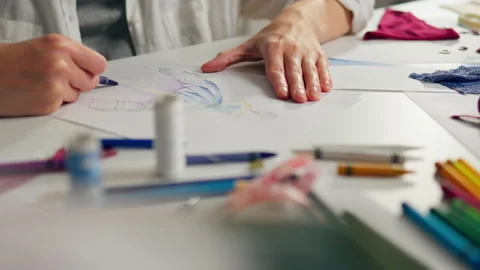 Clothing designer seamstress creates a creative sketch. Fashion designer wor Stock Footage 234719954