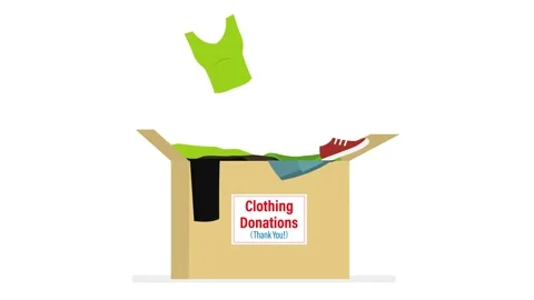 Clothing donation, motion video. Various clothes fall into cardboard box. C.. Stock Footage 307089166
