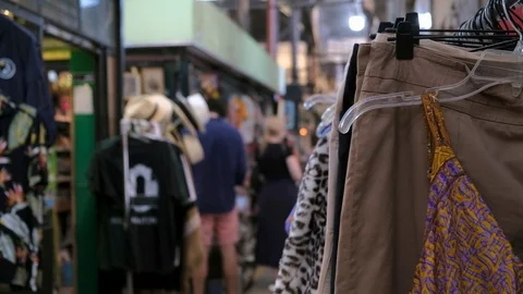 A clothing rack in a second hand store and defocused people on background Stock-Footage 122640652