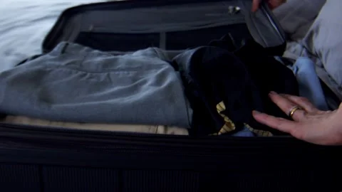 Clothing stack, transit personal items, holiday clothing, close-up Stock Footage 293433387