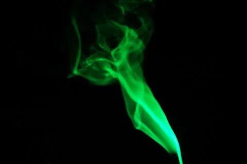Cloud of abstract gr smoke in front of a black background Foto stock