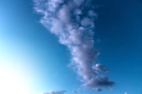 Cloud against the blue sky Stock Photos