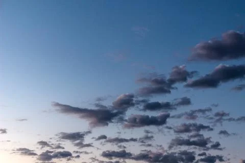 Cloud against the blue sky Stock Photos