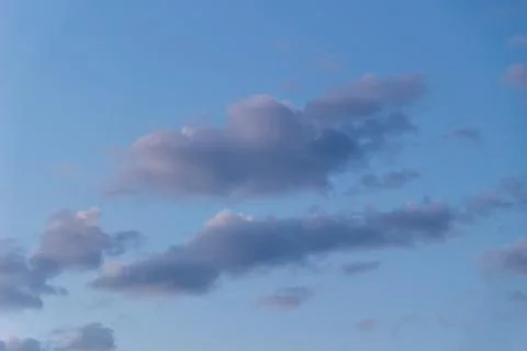 Cloud against the blue sky Stock Photos