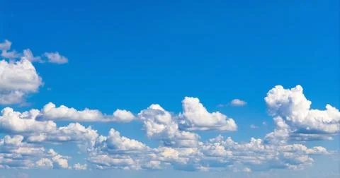 Cloud against cloudy sky. Panoramic blue sky with clouds. Cumulus cloudscape Photos