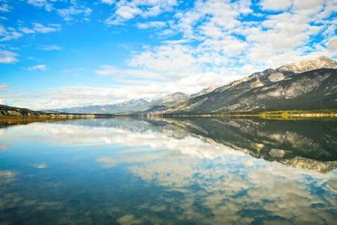 Cloud and Blue Sky Reflection in Mountain Lake Landscape Stock Photos