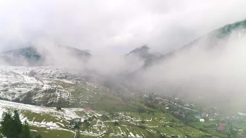 Cloud and mist, top of view to green field and snow, foggy Stock Footage 282245363