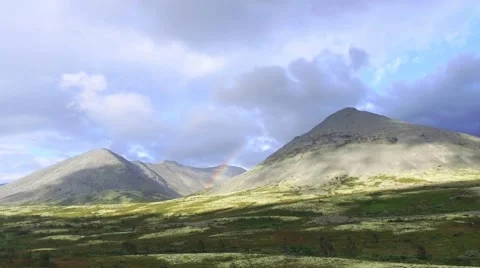 Cloud and Rainbow Over Mountain Video stock 66433219