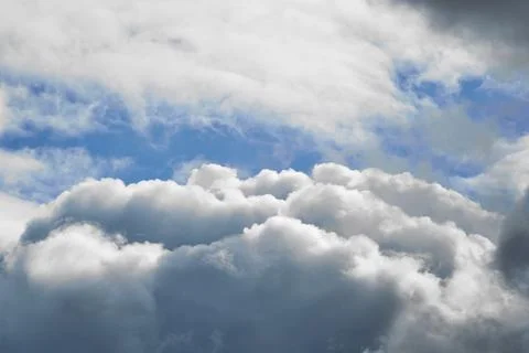 Cloud and sky peering through it close-up, cumulus cloud close-up Stock Photos