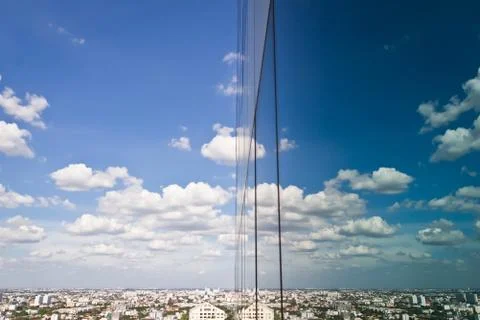 Cloud and sky reflection in mirror of building Stock Photos