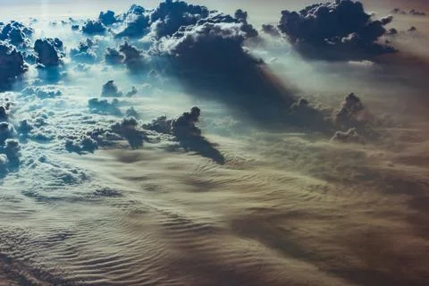 Cloud and sky view from the window of an airplane Stock Photos