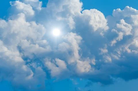Cloud and sun in blue sky Stock Photos