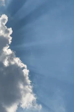 Cloud and Sunbeams Vertical Stock Photos