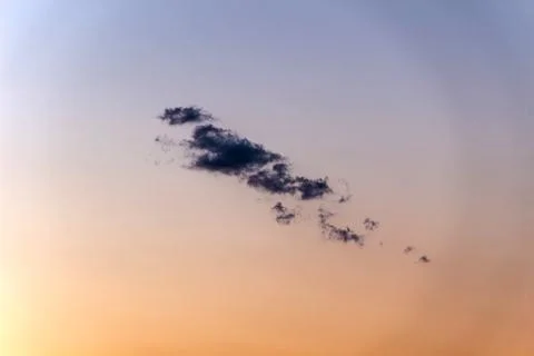 Cloud on a background of purple-orange sky Foto stock