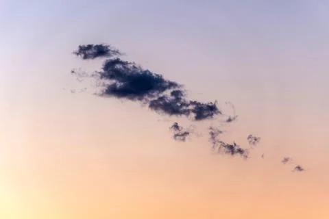 Cloud on a background of purple-orange sky Stock Photos