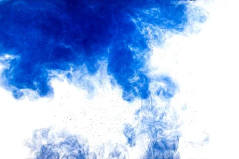A cloud of blue paint released into clear water. Isolate on a white backgroun Stock Photos