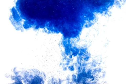 A cloud of blue paint released into clear water. Isolate on a white backgroun Foto stock