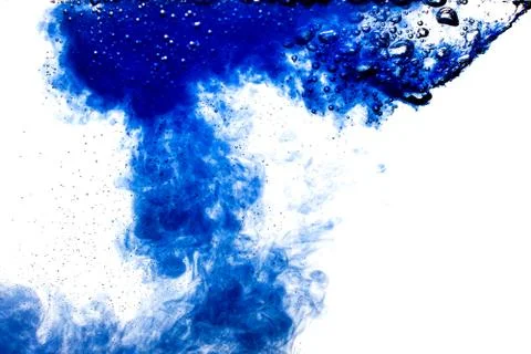 A cloud of blue paint released into clear water. Isolate on a white backgroun Stock Photos