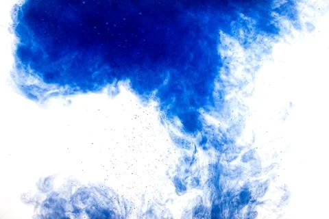A cloud of blue paint released into clear water. Isolate on a white backgroun Foto stock