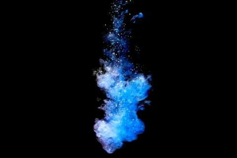 A cloud of blue paint released into clear water. Isolate on a black backgroun Foto stock