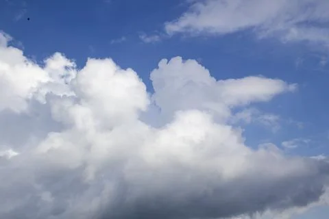 Cloud in the blue sky. A beautiful clouds against the blue sky background. Stock Photos