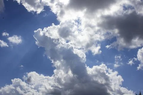 Cloud in the blue sky. A beautiful clouds against the blue sky background. Stock Photos