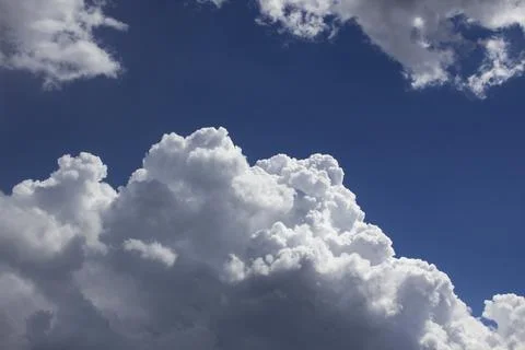 Cloud in the blue sky. A beautiful clouds against the blue sky background. Stock Photos