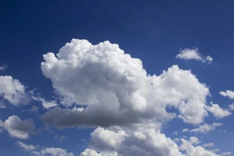 Cloud in the blue sky. A beautiful clouds against the blue sky background. Stock Photos