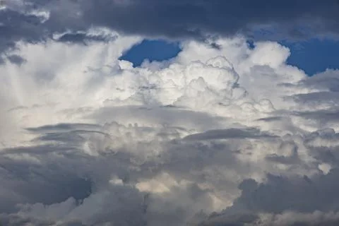 Cloud in the blue sky. A beautiful clouds against the blue sky background. .. Stock Photos