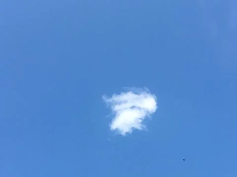 A cloud with a blue sky Stock Photos