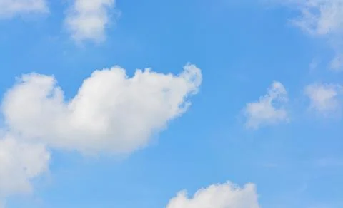 Cloud in the blue sky... Stock Photos