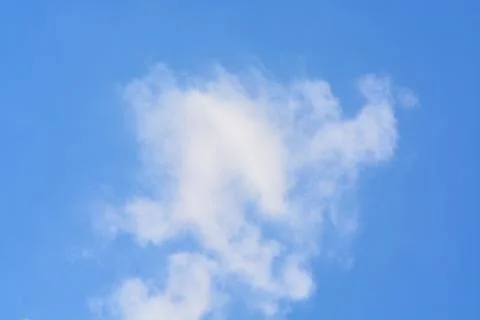 Cloud in the blue sky... Stock Photos
