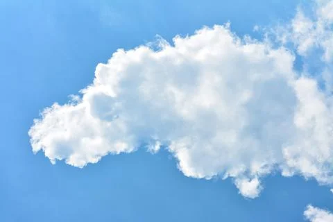 Cloud in the blue sky... Stock Photos