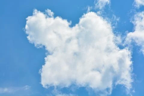 Cloud in the blue sky... Stock Photos
