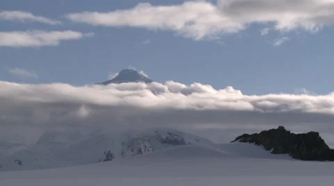 Cloud capped snowy mountain, Antarctica Stock Footage 34312676