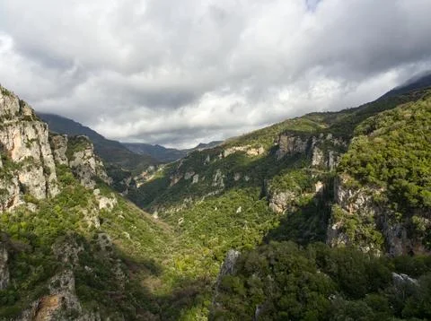 Cloud casting over green gorge Stock Photos