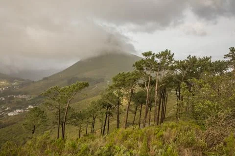 The cloud caught on top of the mountain Stock Photos